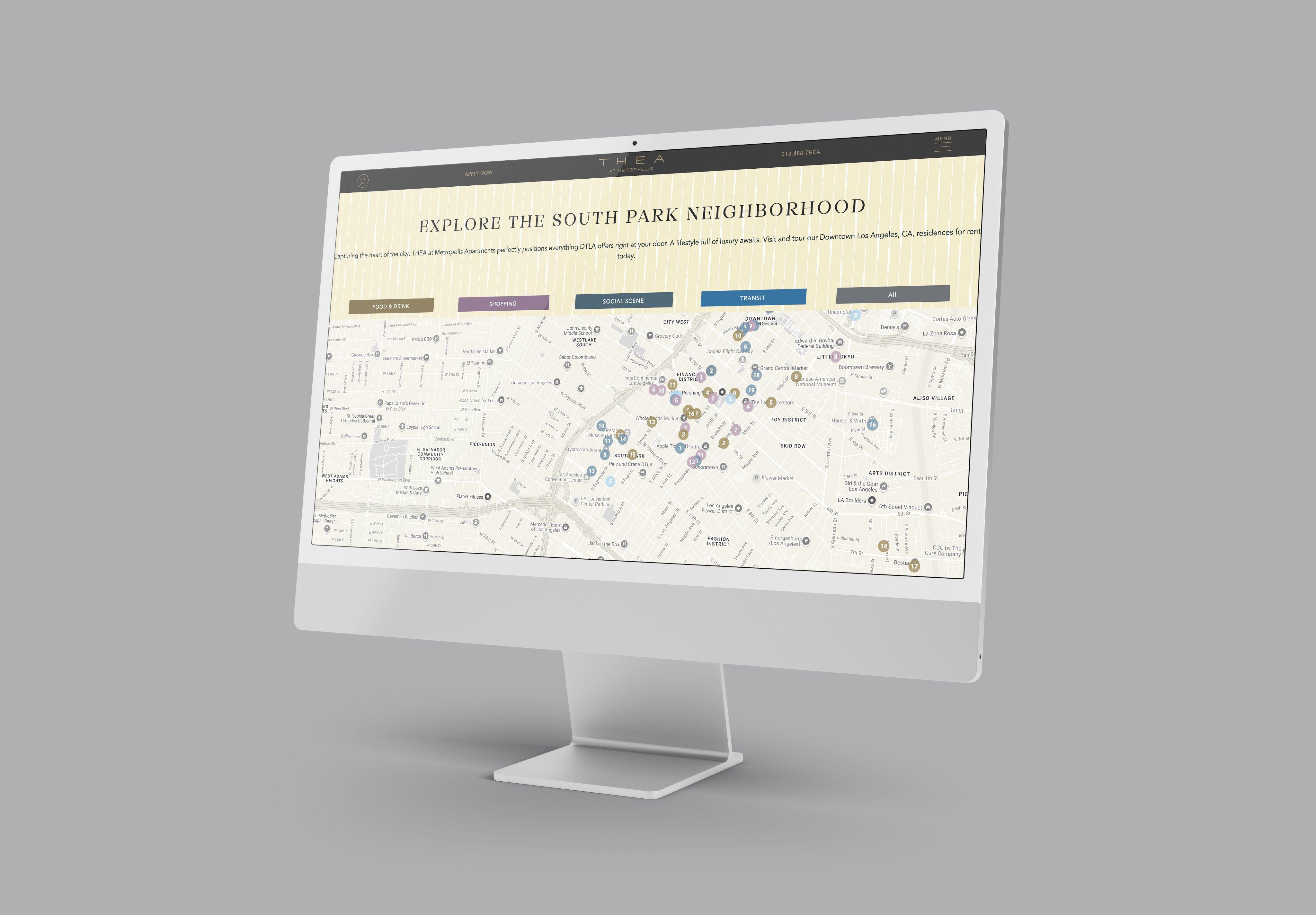 A computer monitor displays a website featuring a map of the South Park neighborhood with color-coded locations and a navigation menu at the top.