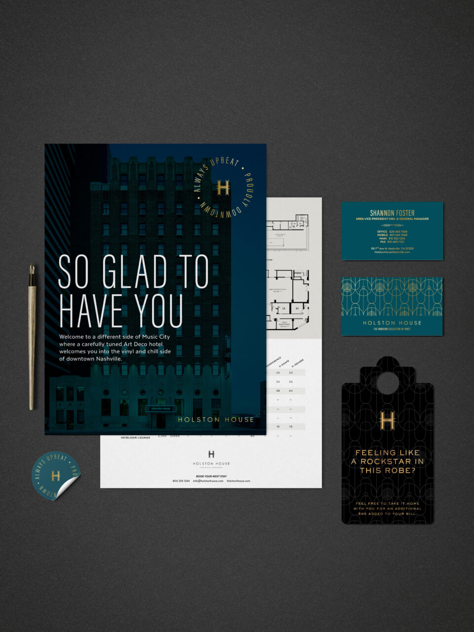 A collection of branded Holston House materials including a brochure, business cards, floor plan, envelope, badge, and circular sticker laid out on a dark surface.