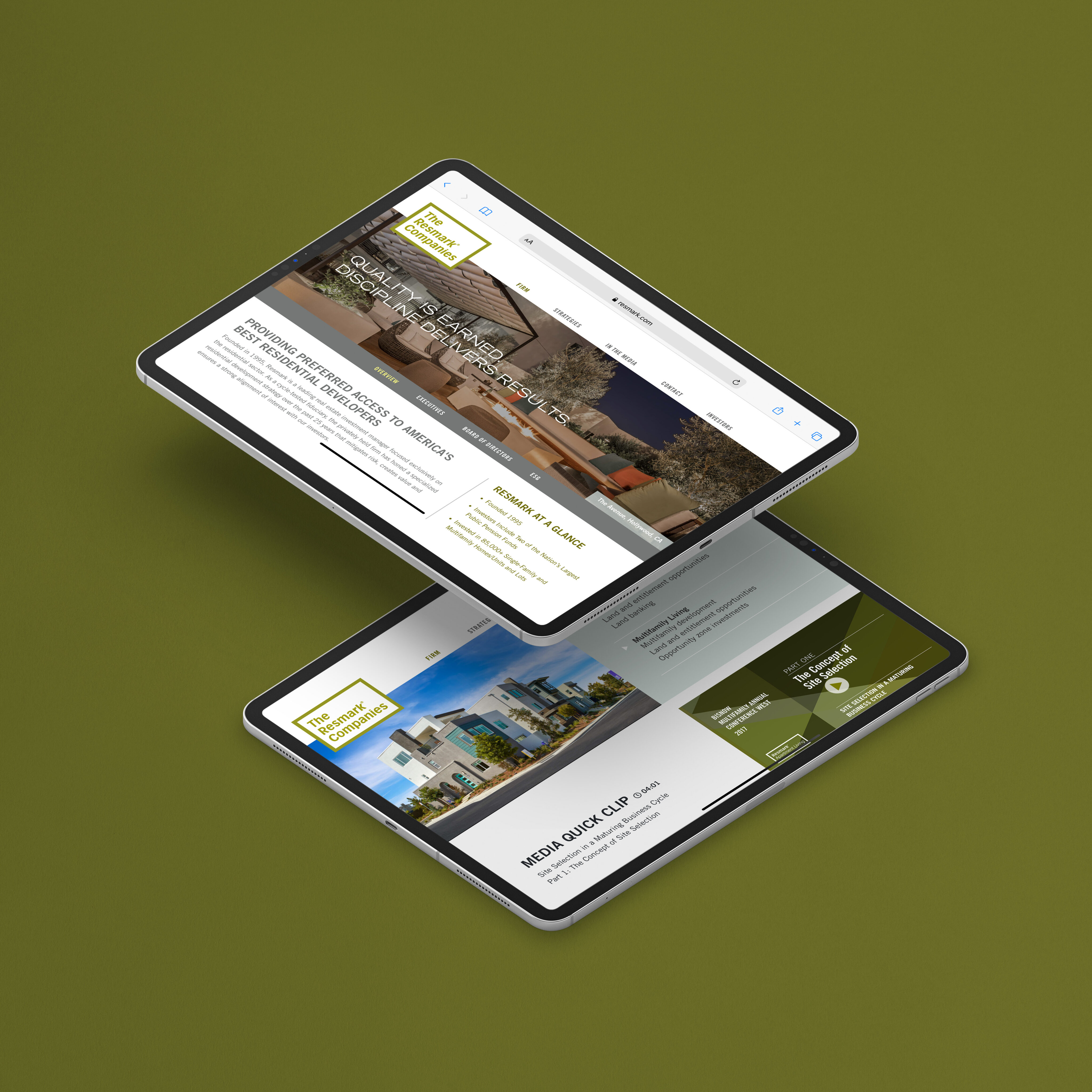 Two tablets display a real estate website with images of buildings, navigation menus, and text about property management against a solid olive green background.