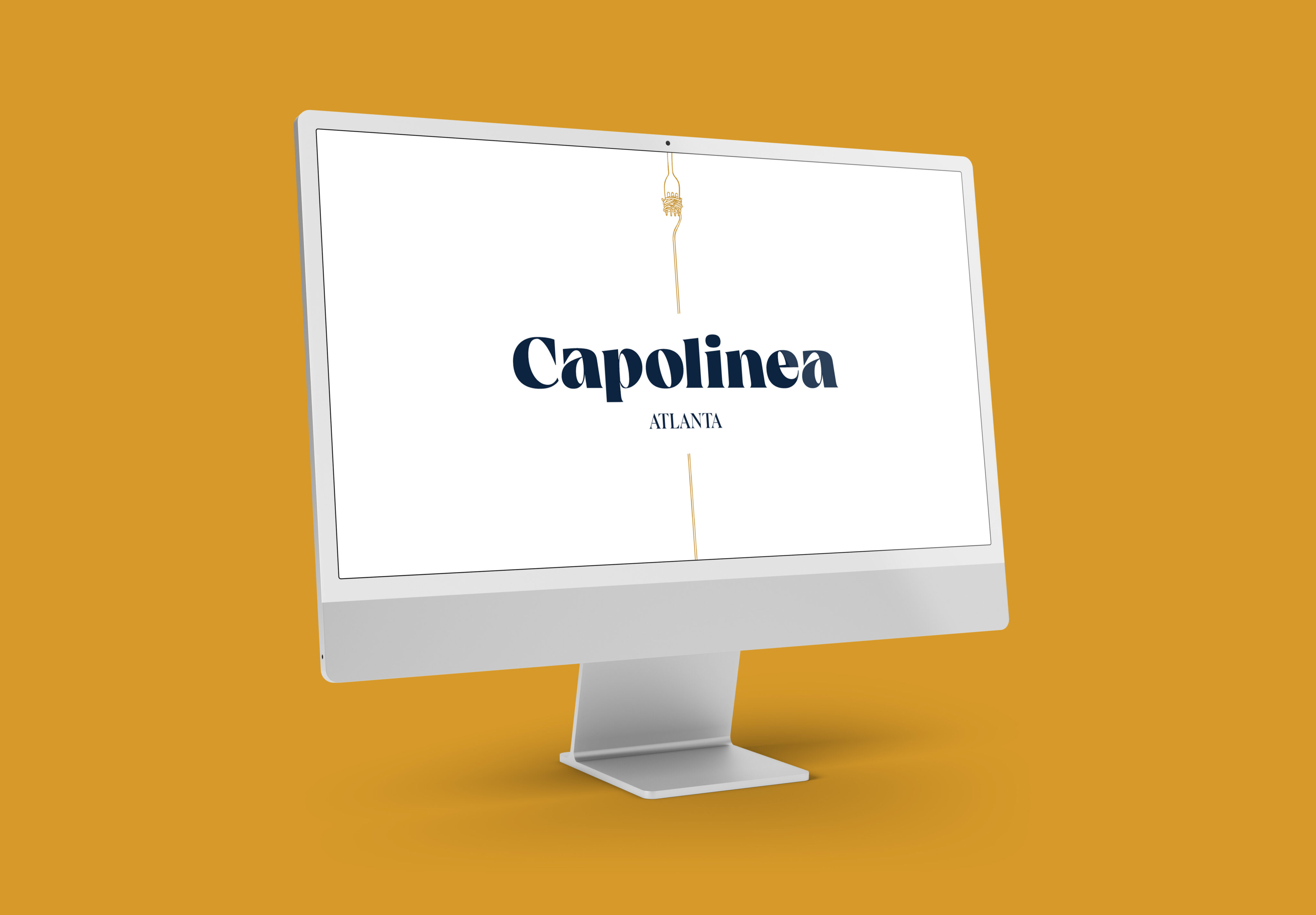 A desktop computer monitor displays the text "Capolinea ATLANTA" on a white background, set against a solid mustard yellow backdrop.