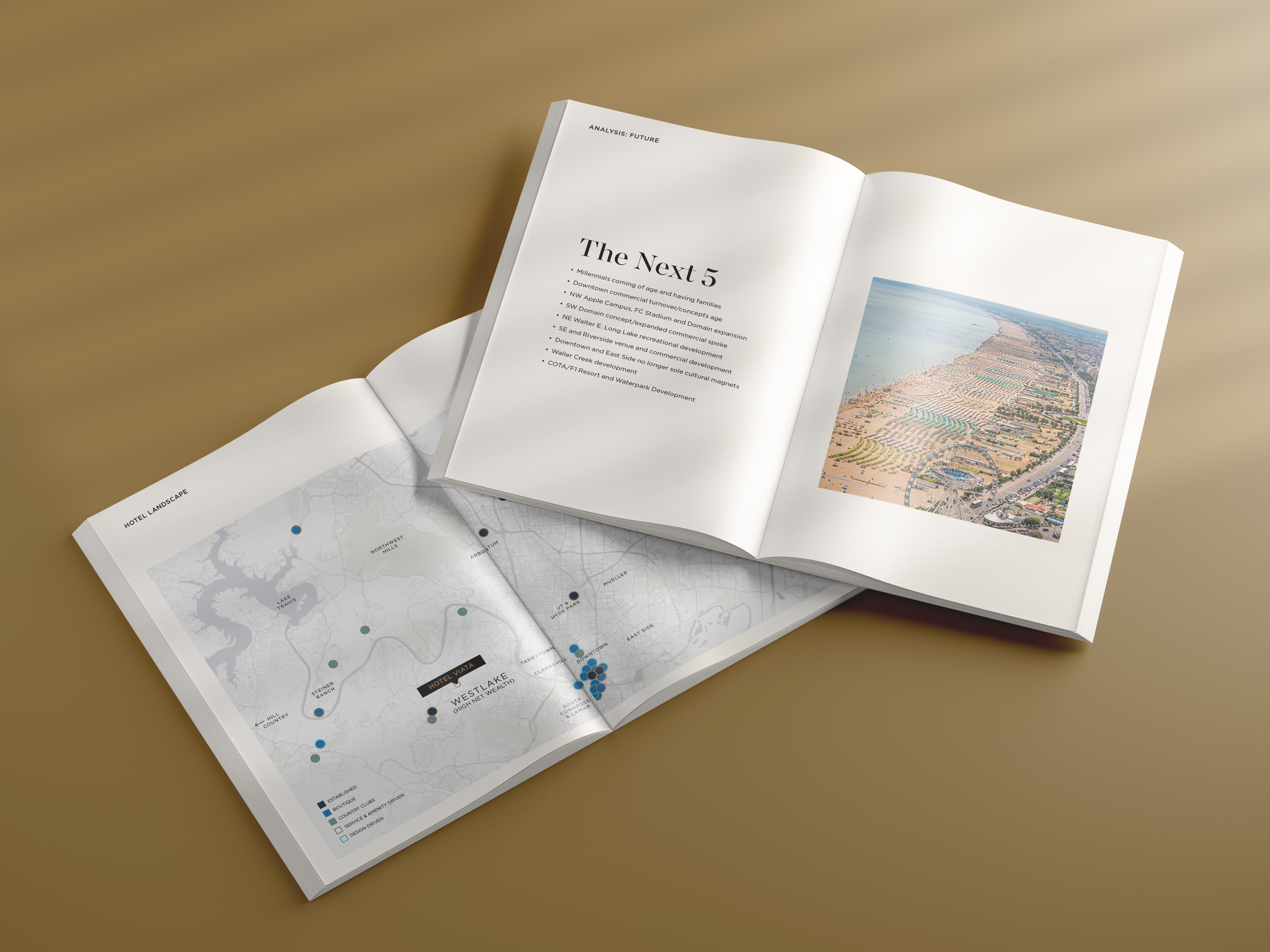 Two open magazines lay on a tan surface; one shows a map with data points, the other displays text titled "The Next 5" and an aerial beach photo.
