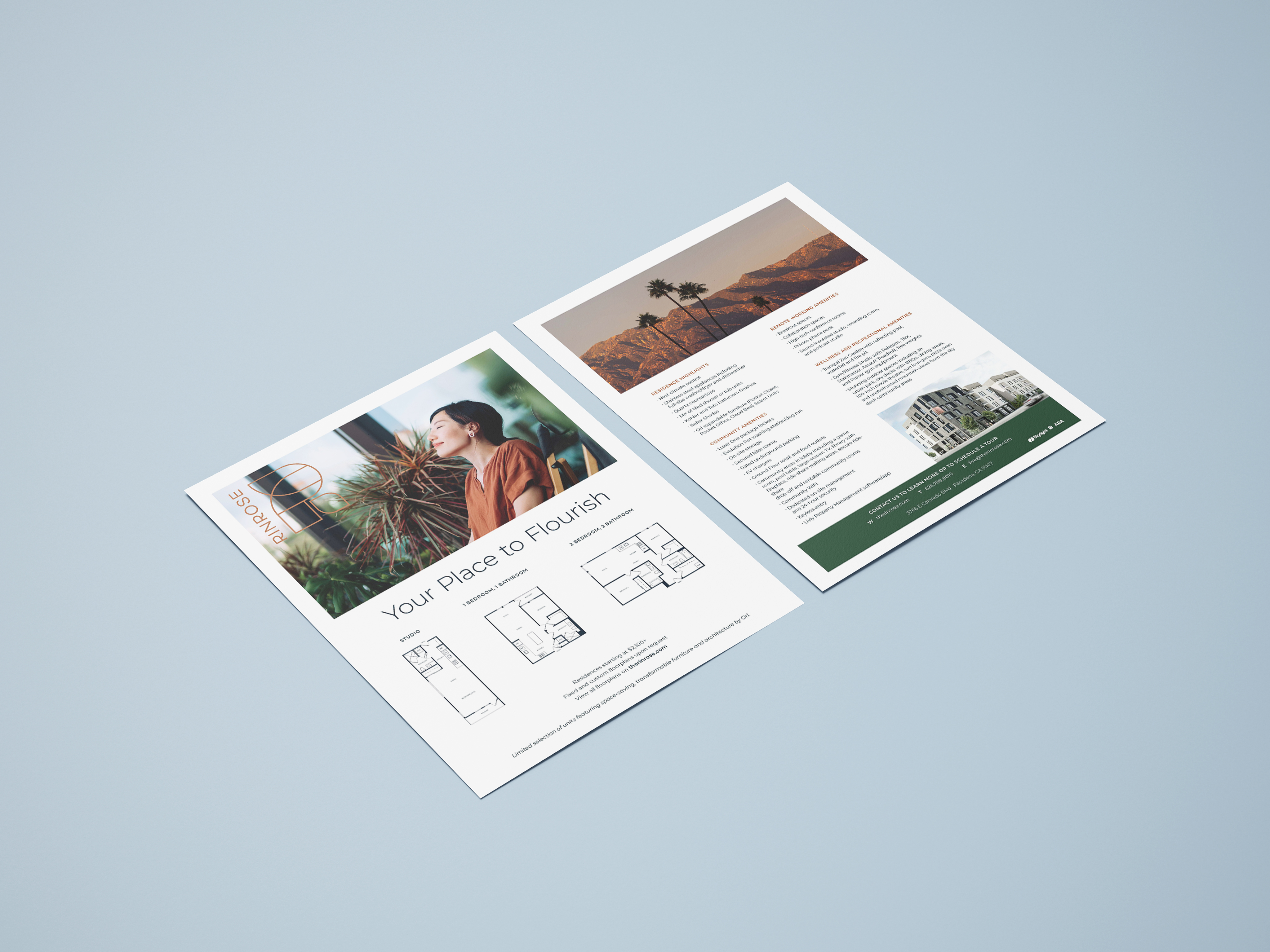 Two real estate flyers on a light blue surface, featuring property photos, floor plans, and descriptive text about available homes.