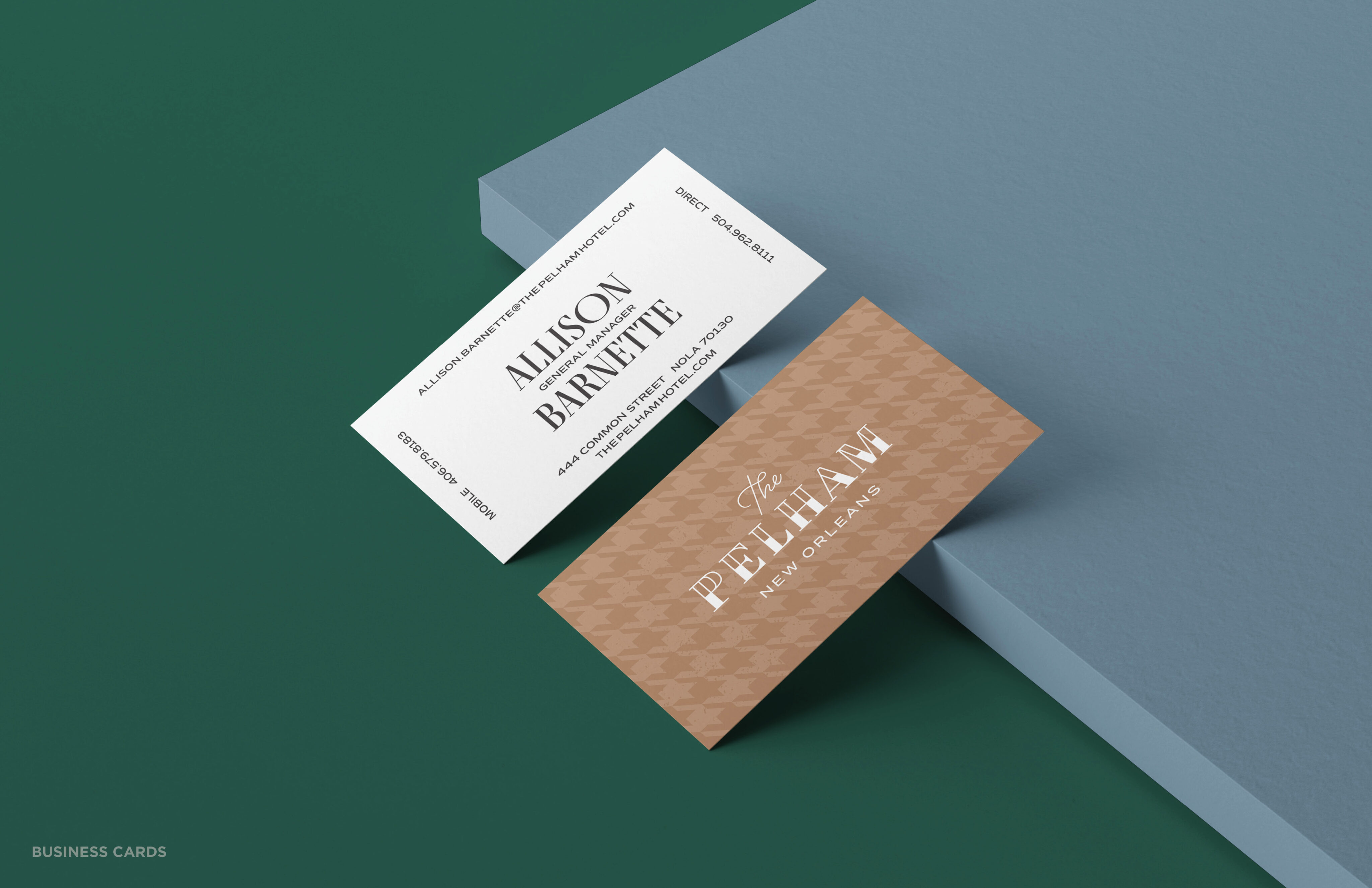 Two business cards are displayed, one white with contact details for Alison Barnett and one brown featuring the logo for The Pelham New Orleans, set on a green and blue background.