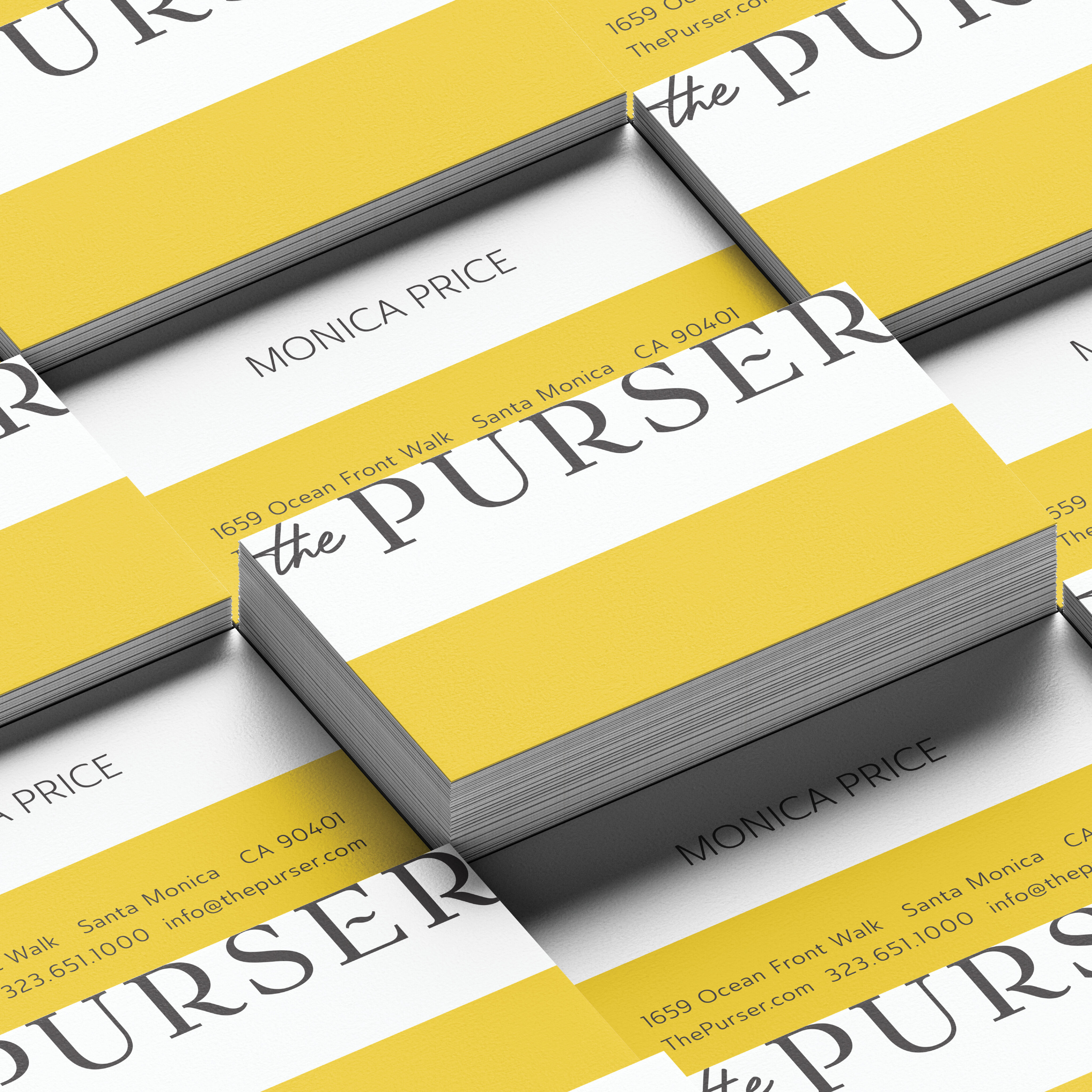 A stack of business cards for "the PURSER" with a yellow and white design, displaying contact details for Monica Price in Santa Monica, California.