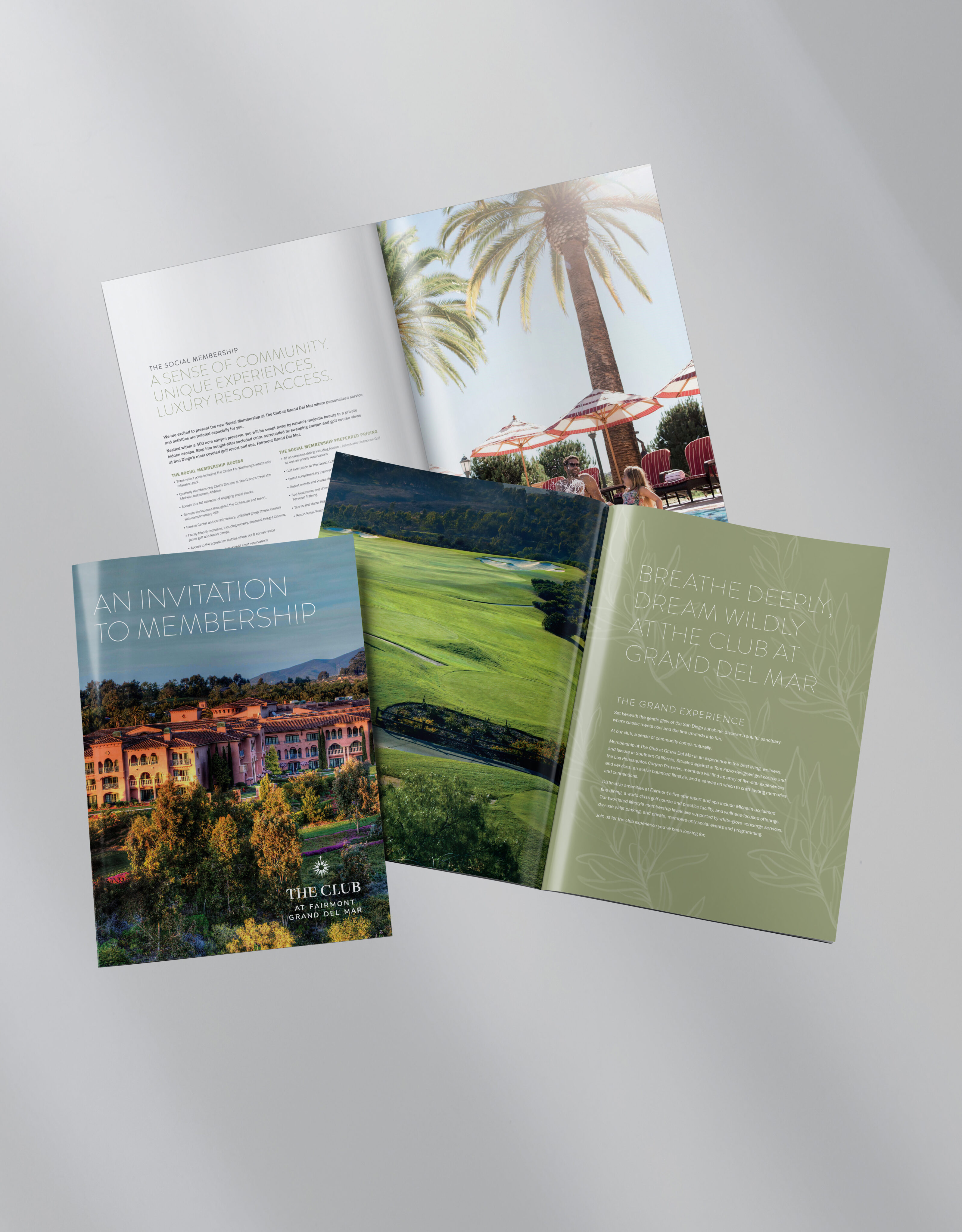 Three brochures featuring colorful images and text about a luxury club membership are displayed on a light gray surface.