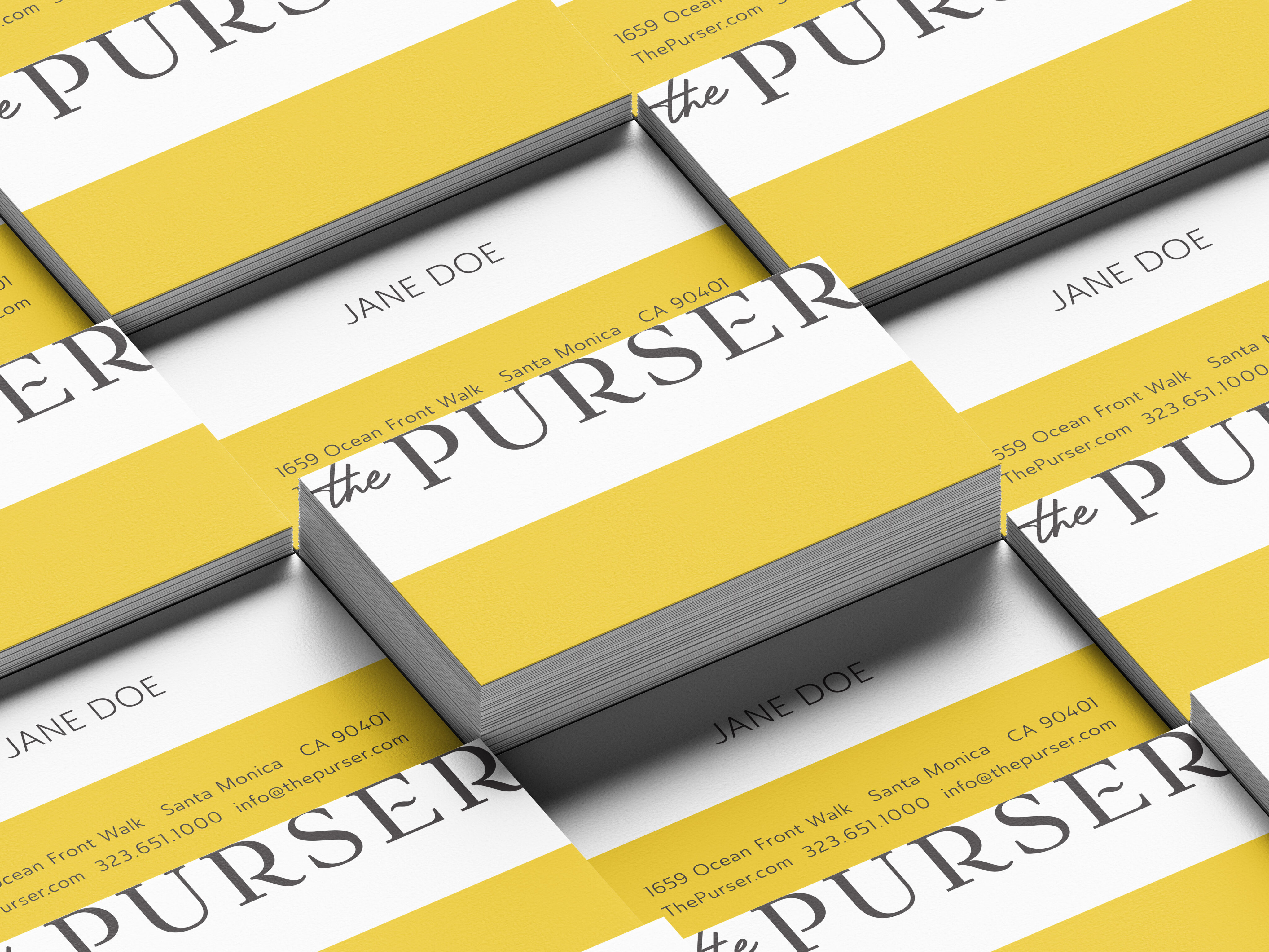 A stack of business cards with a yellow and white design, displaying the name "Jane Doe" and contact information for "the PURSER," offering brand strategy and design solutions in Santa Monica, CA.
