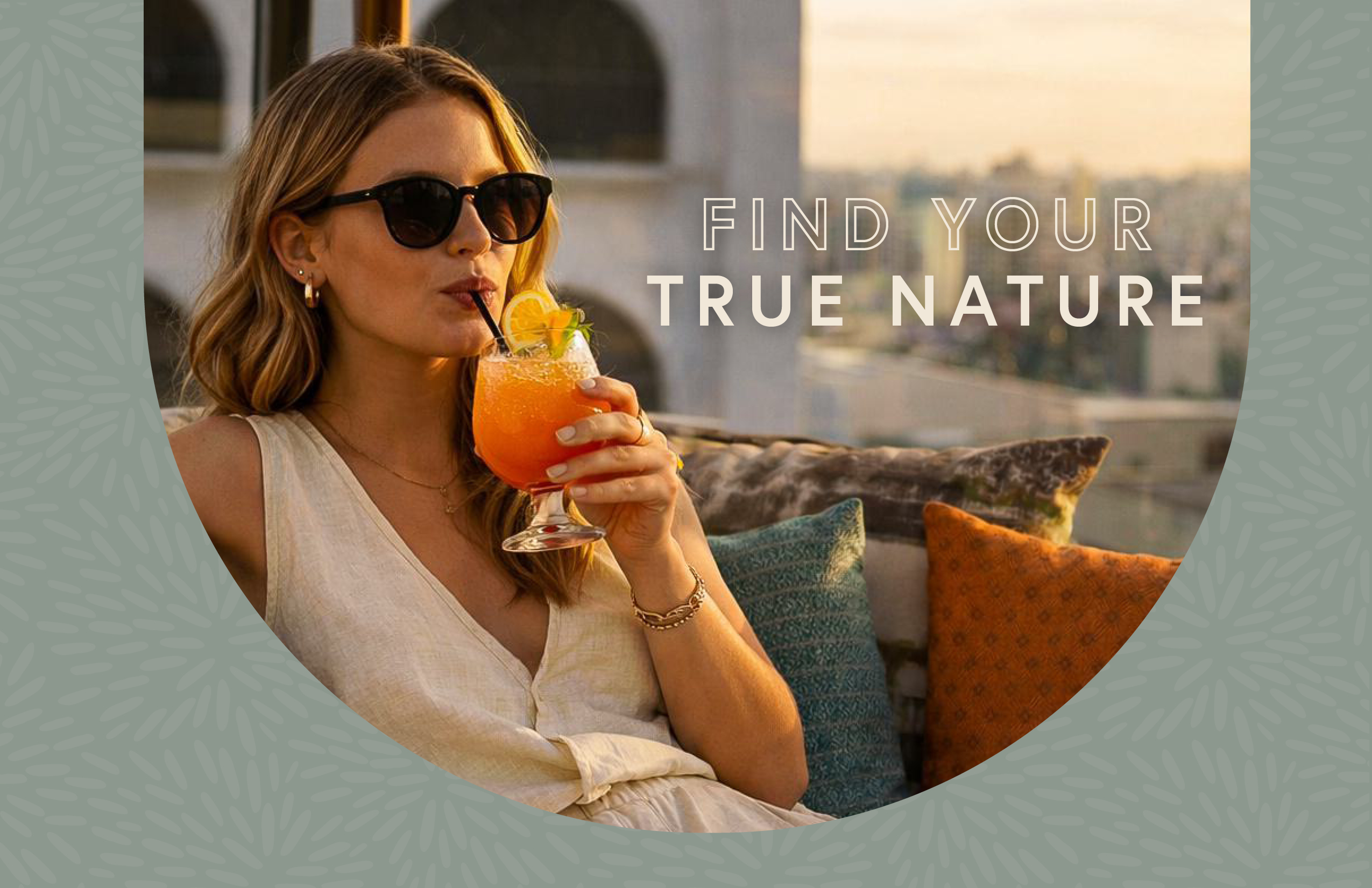 Woman in sunglasses drinks an orange cocktail on an outdoor sofa at sunset. Text reads "Find your true nature." Cityscape visible in the background.