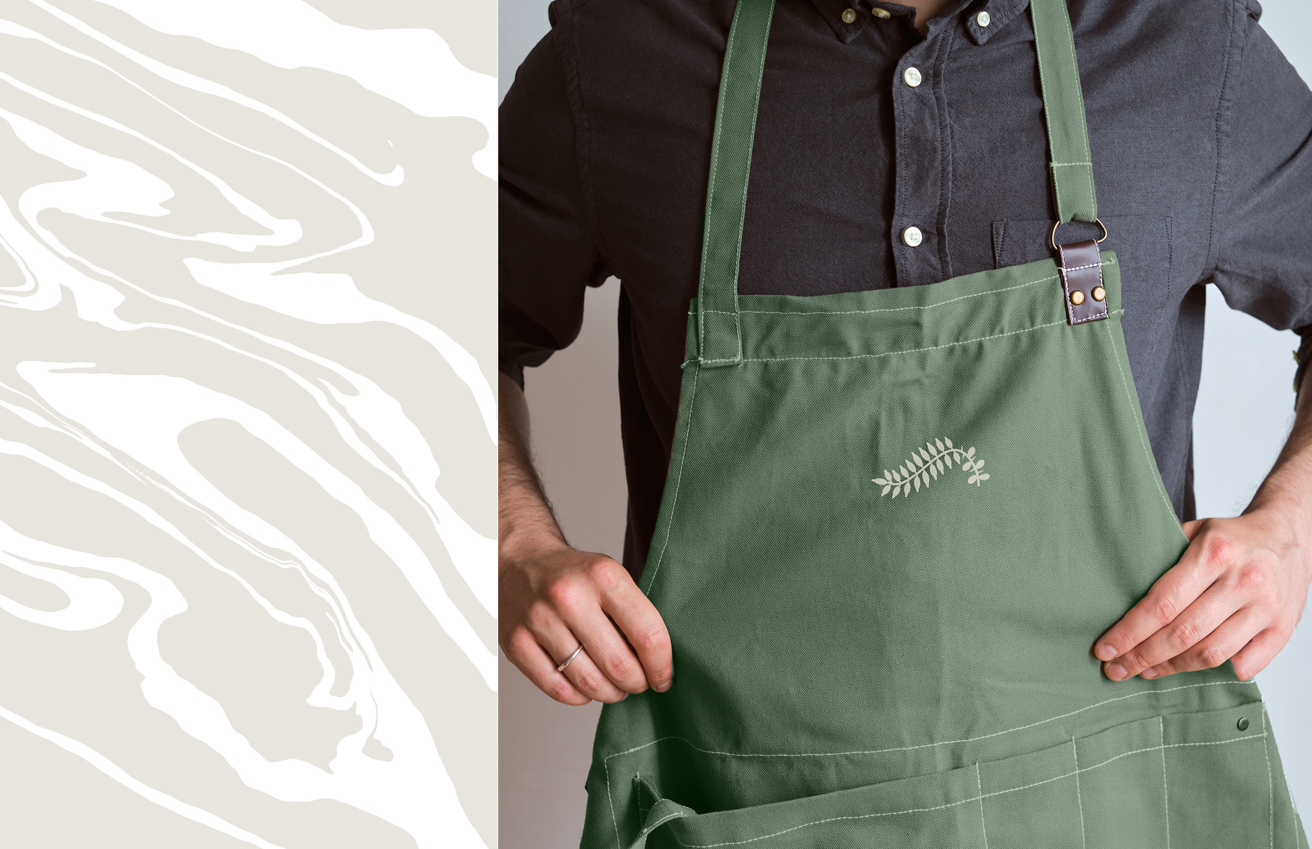 A person in a dark shirt wears a green apron with a small leaf design, adjusting the straps. A beige and white marbled pattern is shown on the left side of the image.